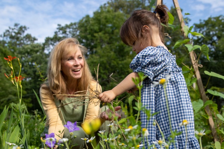 Woman and child in garden