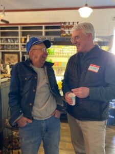 Tom Hutson and Jerry Cosgrove stand together, laughing.